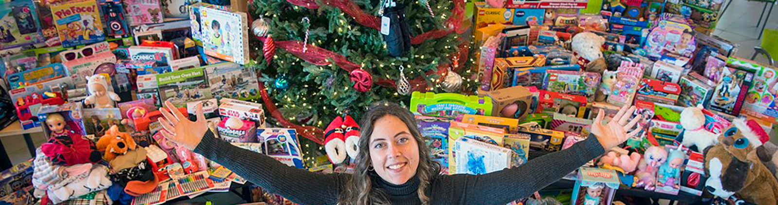 tree of giving surrounded by toys