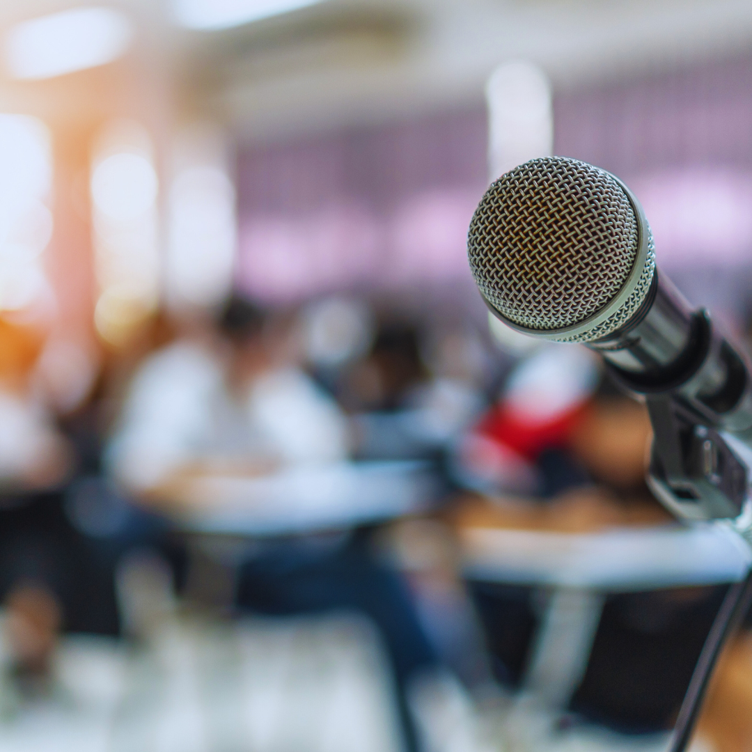 a microphone at a townhall event