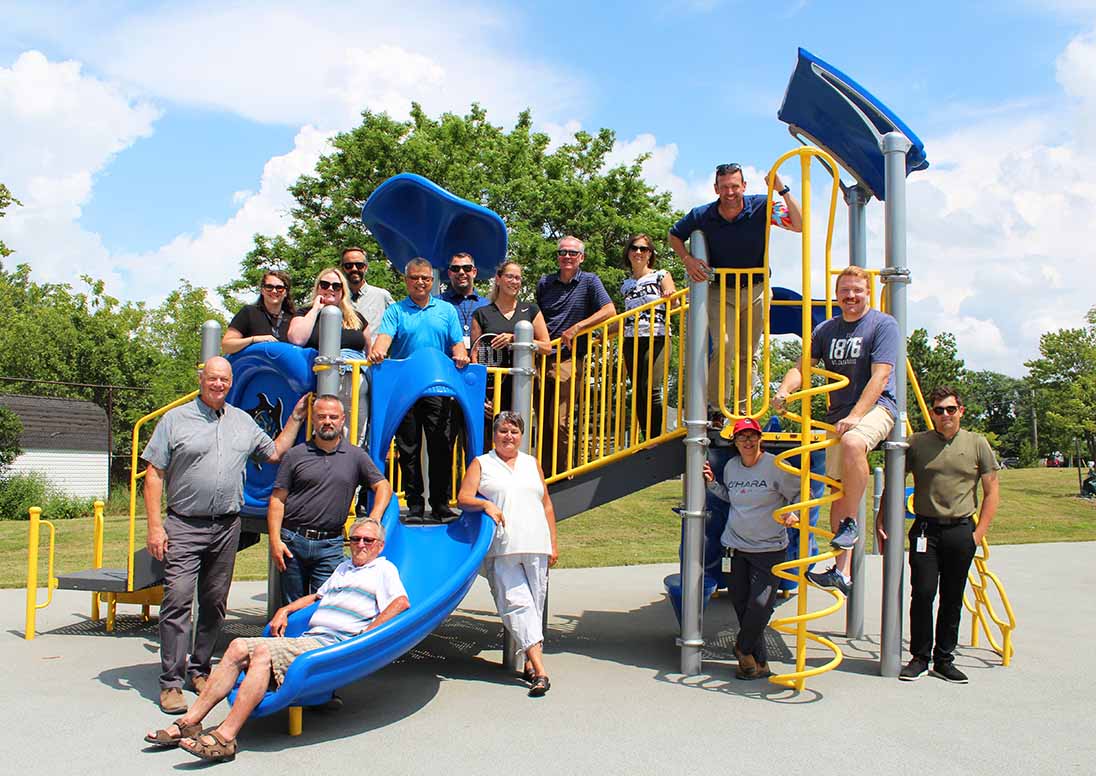 Mayor Mat Siscoe, Ward 1 Merritton Councillors Jackie Lindal and Greg Miller, Jim Richardson, Chair of the City's Recreation Master Plan Advisory Committee and City Staff pose on the new playscape at the Valleyview Park grand reopening.