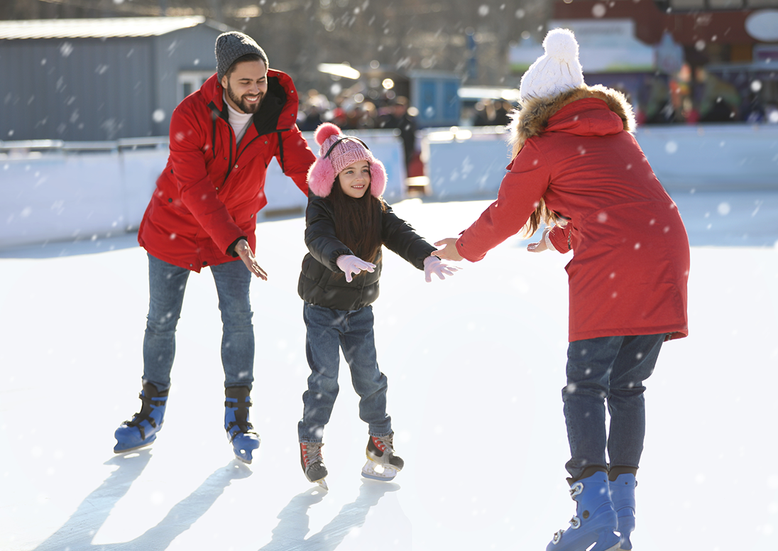 Family skating on outdoor rink